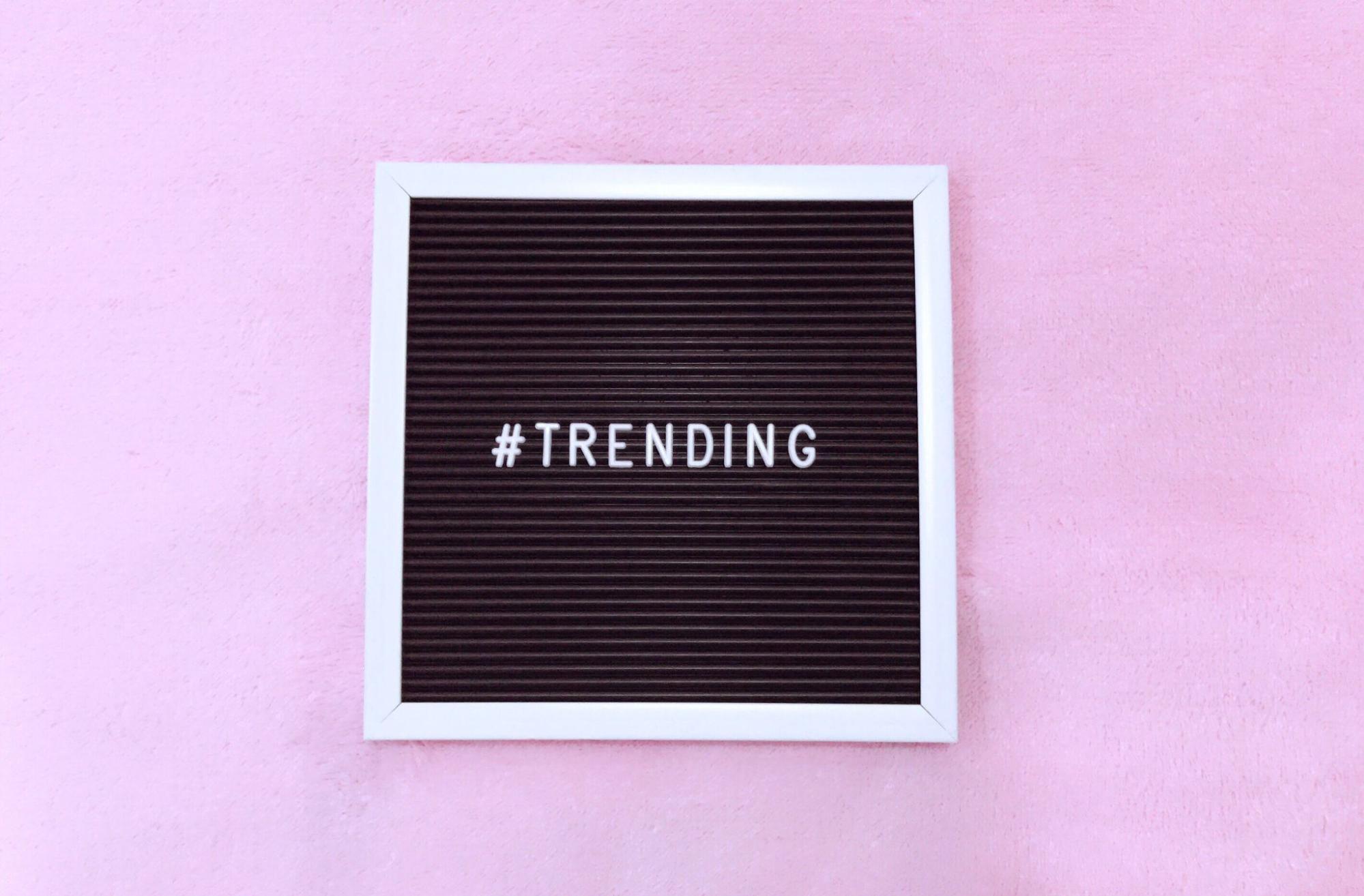 Hashtag trending in white letters on black sign