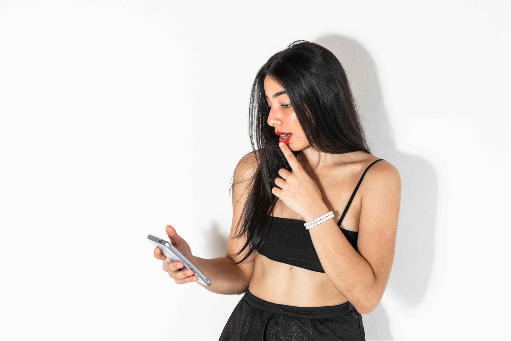 brunette latina woman flirting on phone
