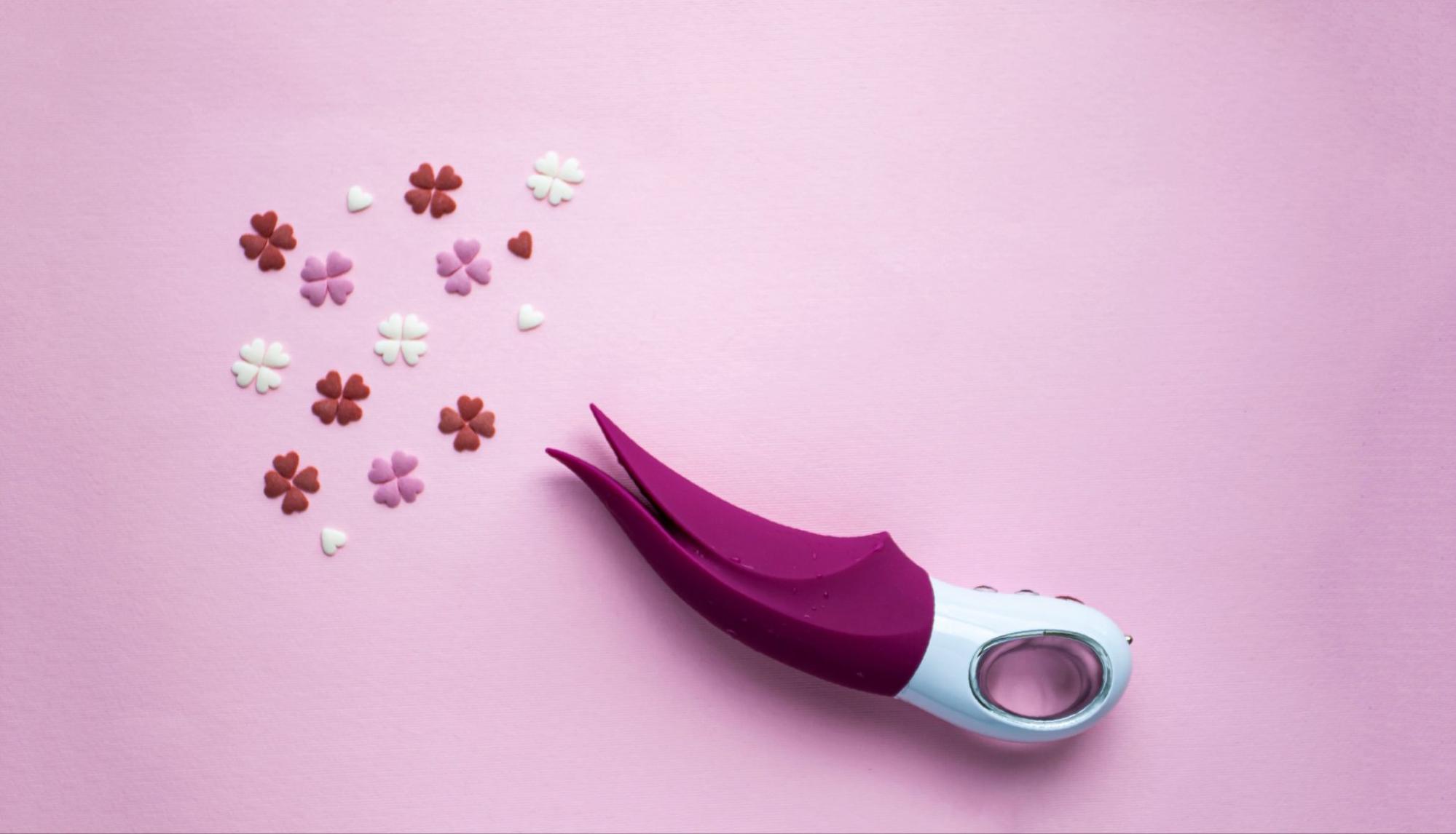 purple clit vibrator pink background