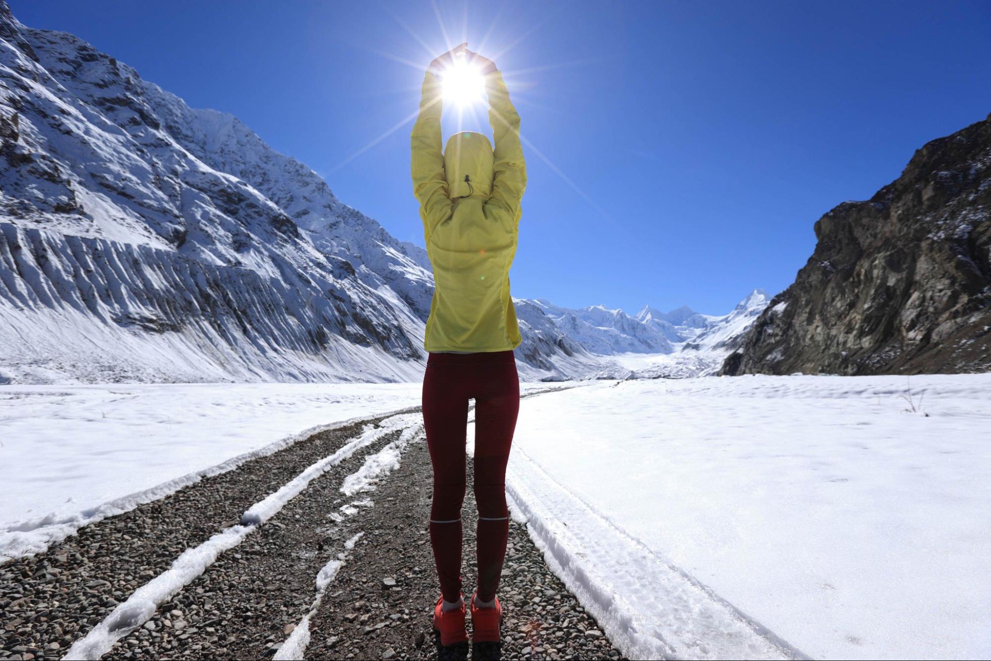 woman in workout clothes running outside in winter