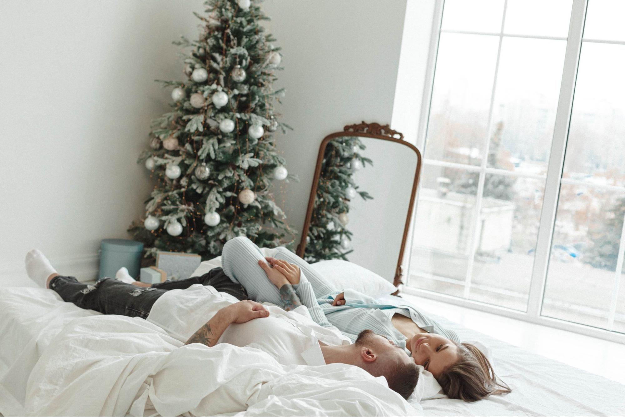 couple in bed in winter cuddling